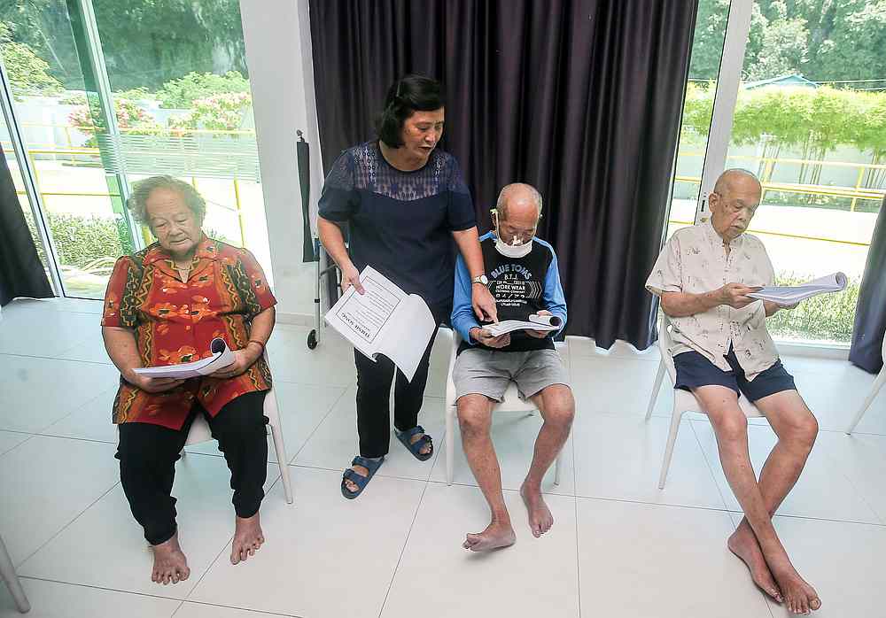 Clients at BebeLEC Day Care Centre for dementia patients have various activities to slow down the progression of the disease. — Picture by Farhan Najib