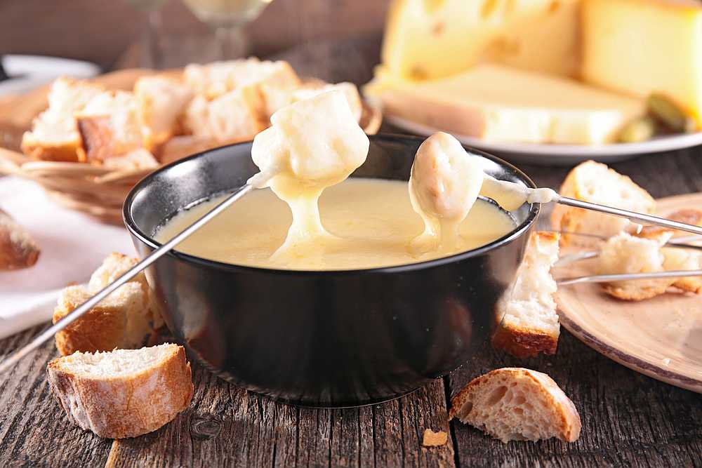 The beloved Swiss national dish consists of cheese melted down with white wine in a 'caquelon' pot heated by an open flame. u00e2u20acu201d istock/margouillatphotos pic via AFP