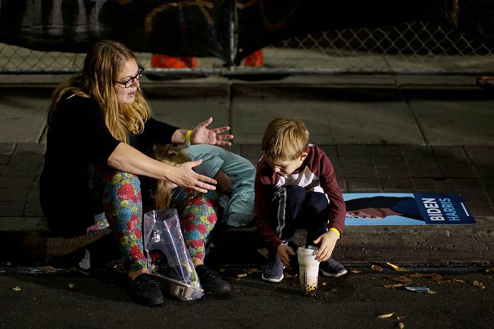 A supporter of Democratic US presidential nominee Joe Biden waits with children outside a vote counting centre in Philadelphia, Pennsylvania November 5, 2020. u00e2u20acu201d Reuters pic