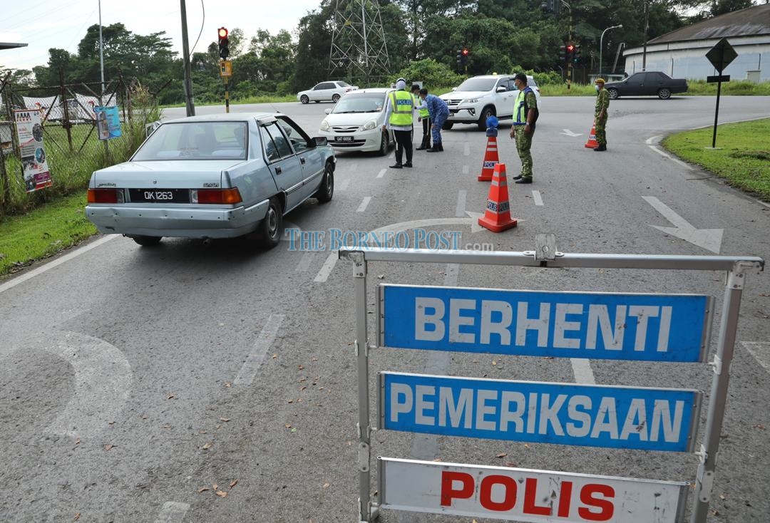 No one is allowed to leave the Kampung Haji Baki EMCO area without permission from the police. u00e2u20acu2022 Borneo Post pic