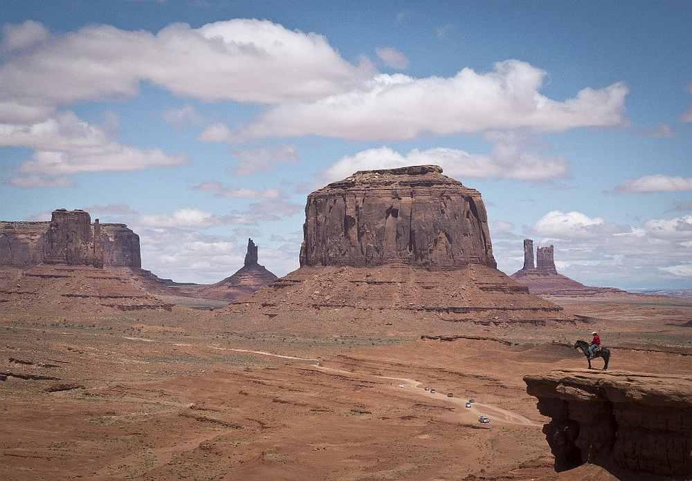 A Navajo man on a horse poses for tourists in front of the Merrick Butte in Monument Valley Navajo Tribal park, Utah May 12, 2014. u00e2u20acu201d AFP pic