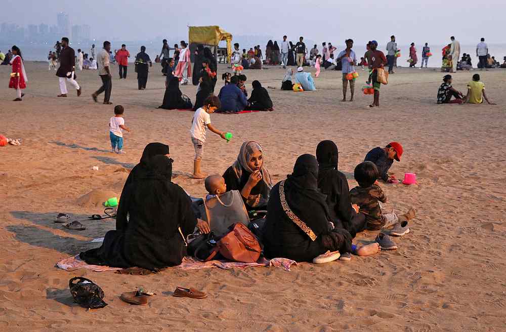 Beachgoers relax on a beach, amid the Covid-19 outbreak, in Mumbai, India October 30, 2020. u00e2u20acu201d Reuters pic