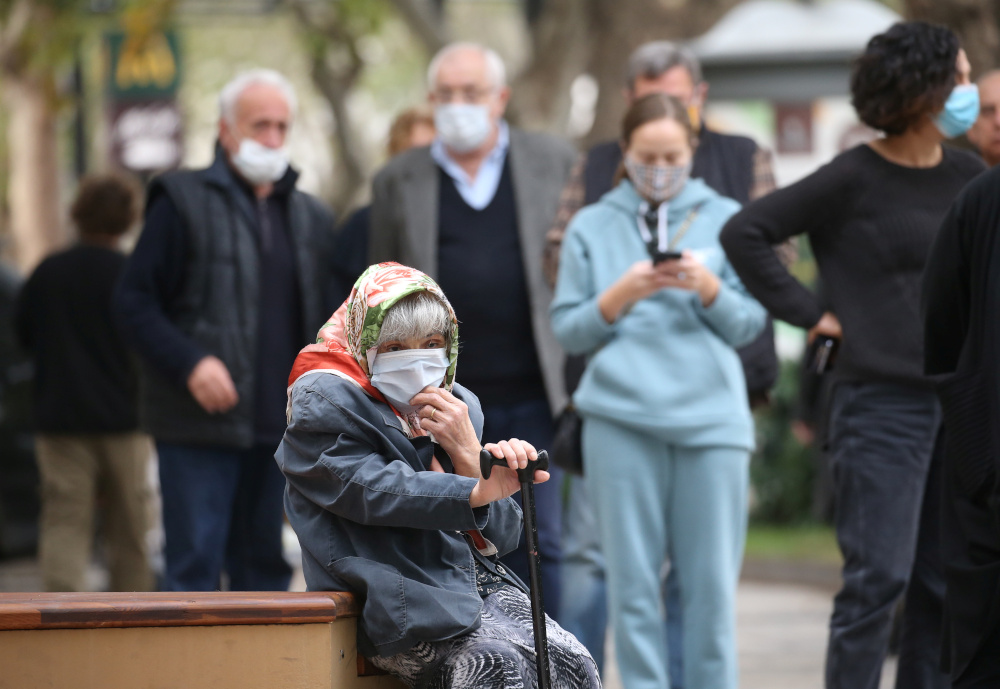 An elderly woman sits as she waits outside a polling station during a parliamentary election in Tbilisi, Georgia October 31, 2020. u00e2u20acu201d Reuters pic 
