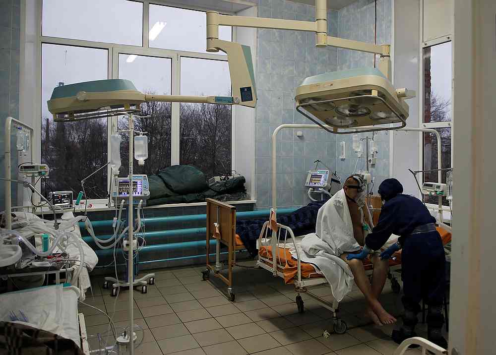 A medical specialist in protective gear takes care of a Covid-19 patient at the intensive care unit of the Vologda City Hospital Number 1, in Vologda, Russia November 24, 2020. u00e2u20acu201d Reuters pic