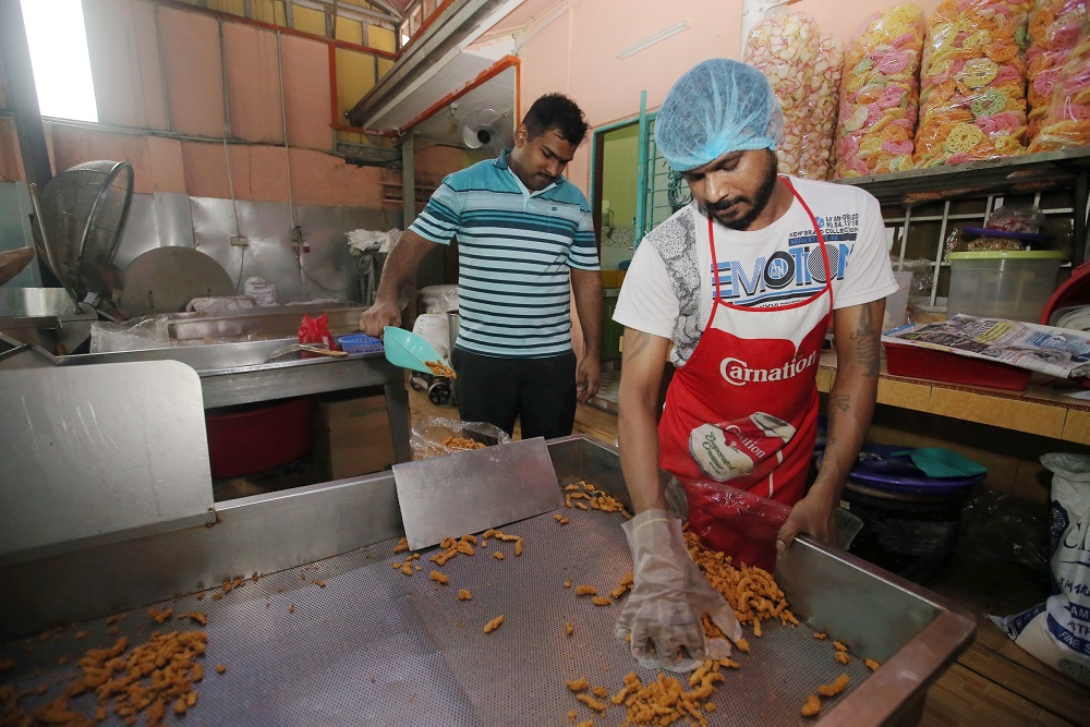There are seven people manning the kitchen of CTS Kacang Puteh Enterprise in Buntong, Ipoh.