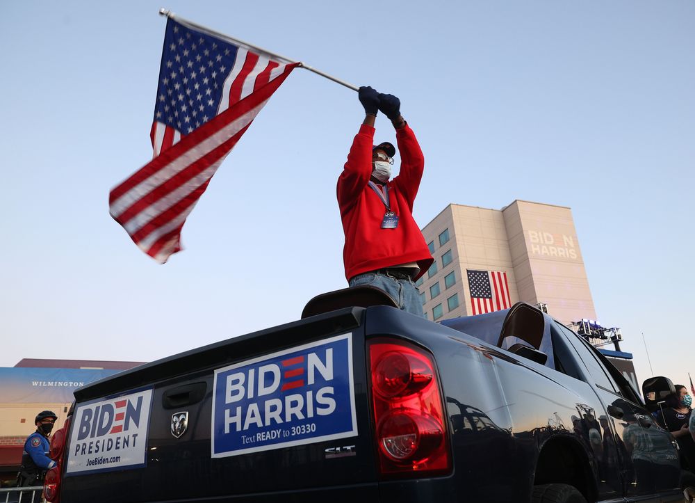 Supporters of President-elect Joe Biden wait for him to address the nation from the Chase Center November 07, 2020 in Wilmington, Delaware. u00e2u20acu201d Win McNamee/Getty Images via AFP