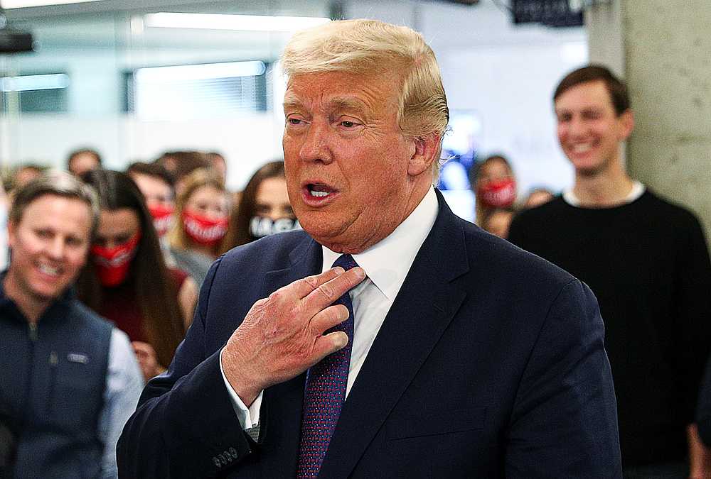 US President Donald Trump greets staff members during a visit to his presidential campaign headquarters on Election Day, in Arlington, Virginia November 3, 2020. u00e2u20acu201d Reuters pic