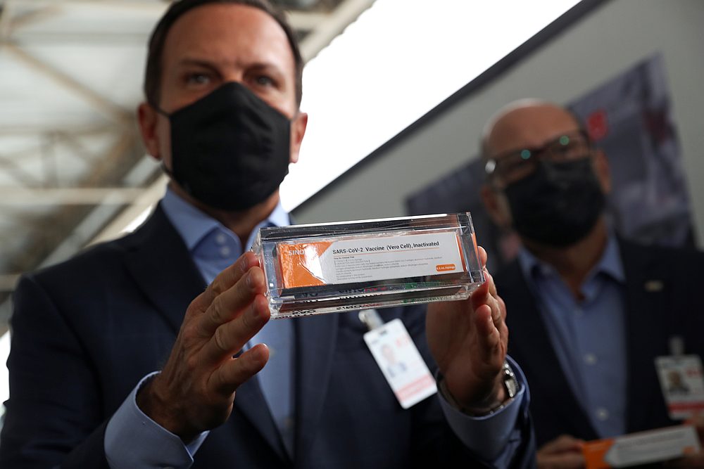Brazil's Sao Paulo state governor Joao Doria (left) and director of Instituto Butantan Dimas Tadeu Covas hold boxes of the China's Sinovac vaccine at Sao Paulo International Airport in Guarulhos, Brazil November 19, 2020. u00e2u20acu201d Reuters pic