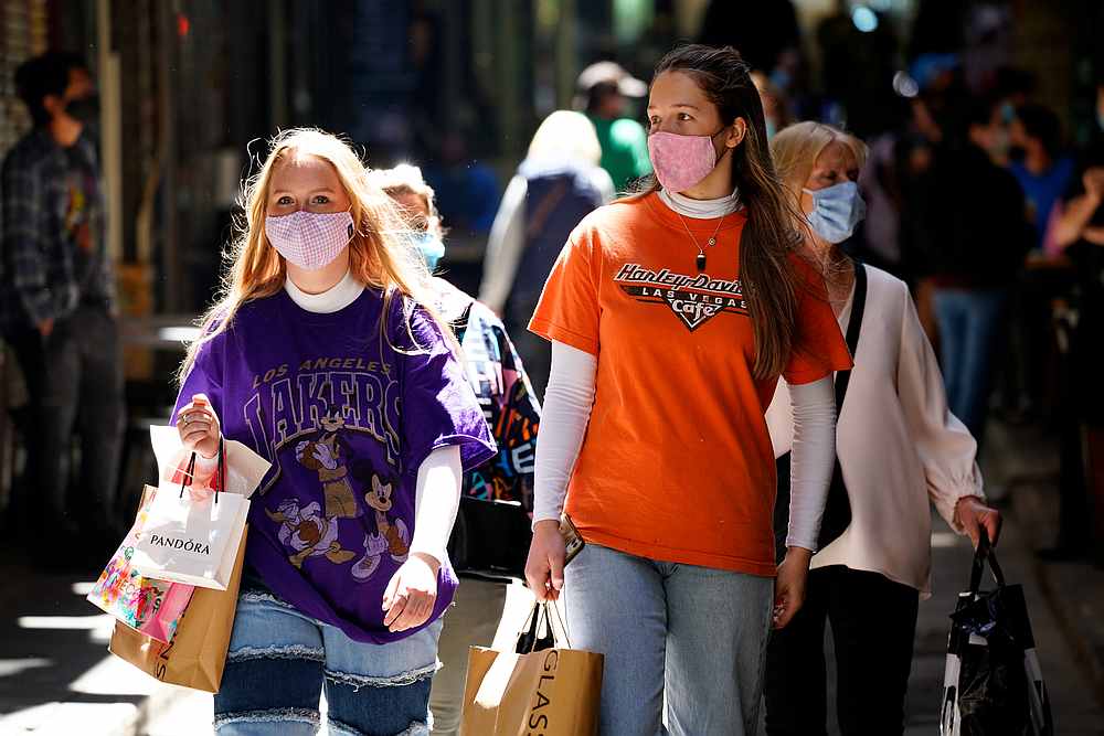 Shoppers walk down a city laneway after Covid-19 restrictions were eased for the state of Victoria, in Melbourne, Australia October 28, 2020. u00e2u20acu201d Reuters pic