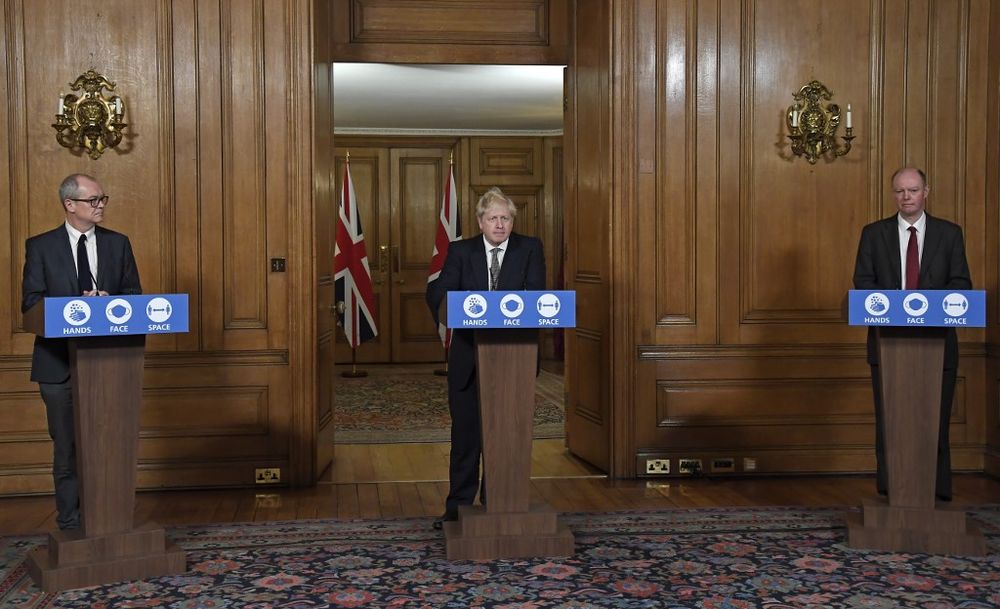 Britain's Prime Minister Boris Johnson, Britain's Chief Scientific Adviser Patrick Vallance (left) and Britain's Chief Medical Officer for England Chris Whitty attend a virtual press conference inside 10 Downing Street, London, October 31, 2020. u00e2u20acu201d AFP p