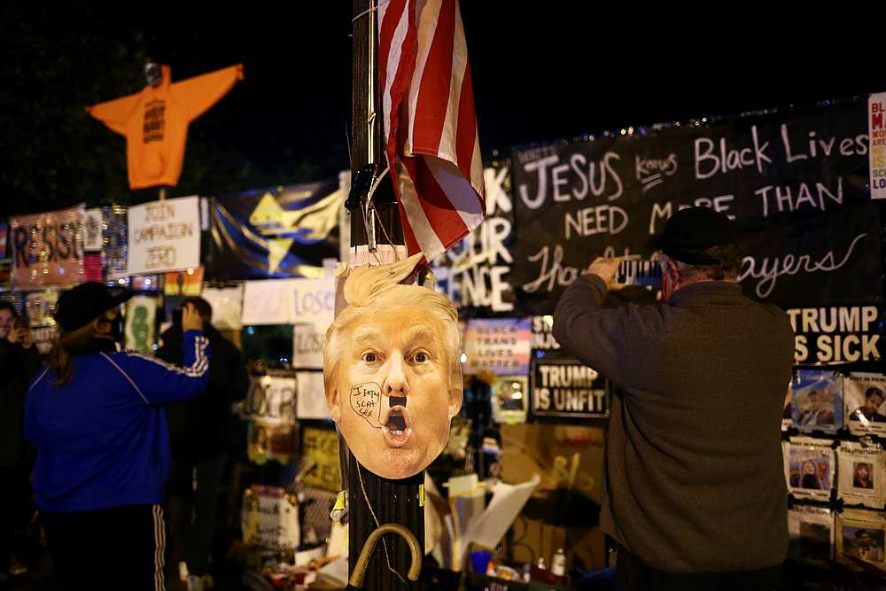 A mask depicting US President Donald Trump is seen as supporters of Democratic nominee Joe Biden gather near the White House during Election Day in Washington November 3, 2020. u00e2u20acu201d Reuters pic
