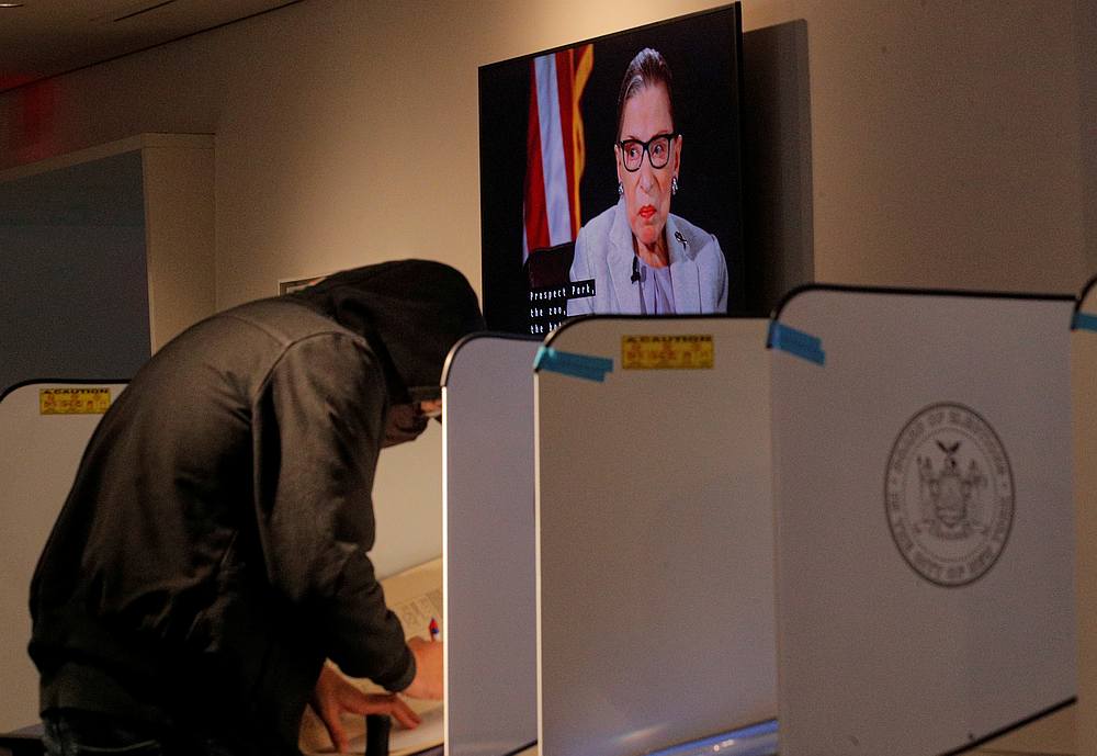 A screen displays an image of late Supreme Court Justice Ruth Bader Ginsburg as a voter fills out a ballot during early voting in Brooklyn, New York October 29, 2020. u00e2u20acu201d Reuters pic 