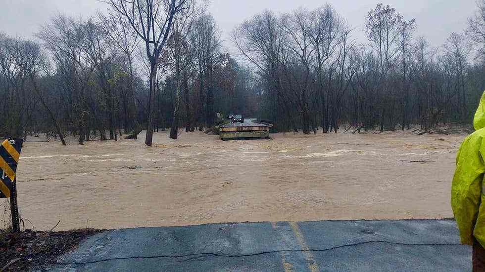 Floodwaters washed out a large section of a road in Iredell County near Statesville, North Carolina November 12, 2020. u00e2u20acu201d Image courtesy of Twitter/@IredellFirewire