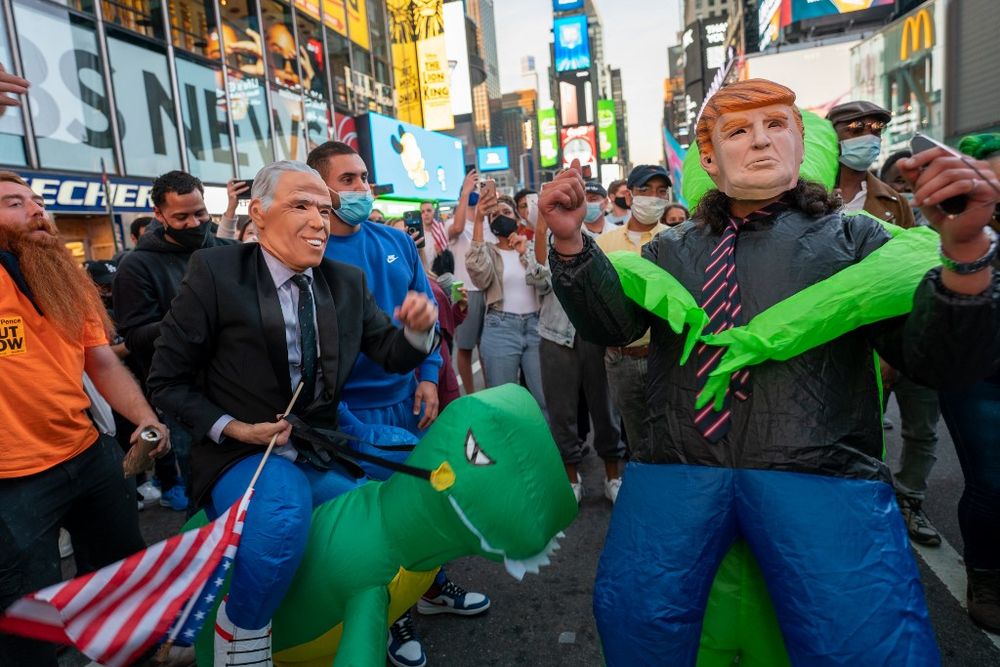People celebrate in the streets in Times Square on November 7, 2020 in New York City. u00e2u20acu201d Getty Images via AFP
