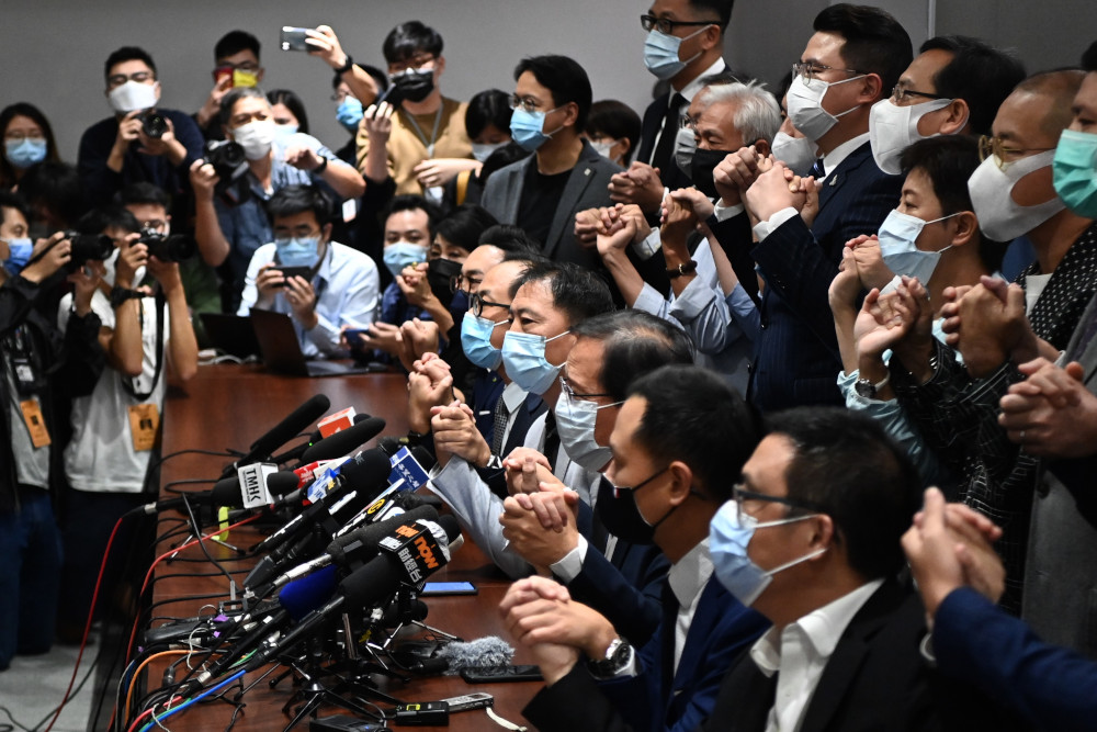 Pro-democracy lawmakers join hands at the start of a press conference in a Legislative Council office in Hong Kong November 11, 2020. u00e2u20acu201d AFP picnn