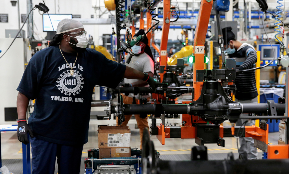 Dana Inc assembly technicians wear face masks as they assemble axles for automakers, as the auto industry begins reopening amid the coronavirus disease outbreak, at the Dana plant in Toledo, Ohio, US, May 18, 2020. u00e2u20acu201d Reuters pic