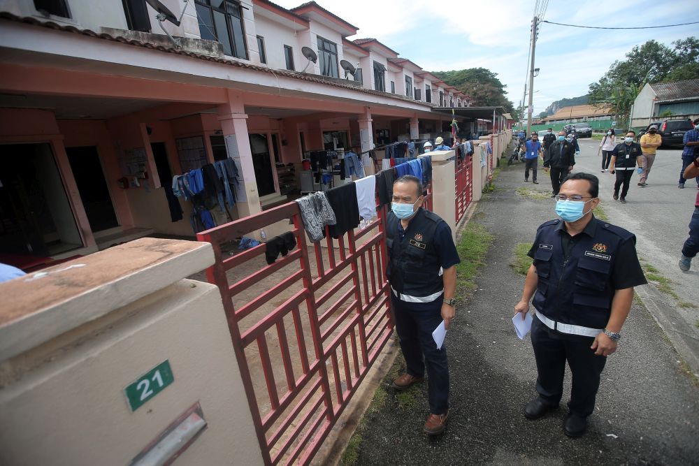 Officers from the Labour Department conduct checks on a workeru00e2u20acu2122s hostel in Tasek, Ipoh November 26, 2020. u00e2u20acu201d Picture by Farhan Najib