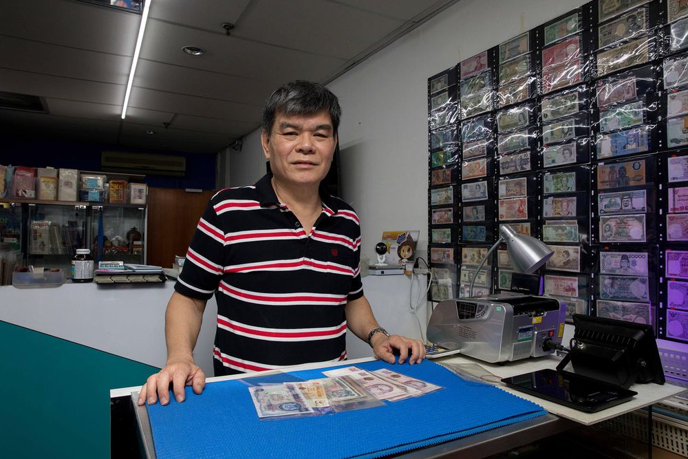 Laurence Lau of Coins and Coins, a shop that buys coins and banknotes, located at Sim Lim Square. — TODAY pic
