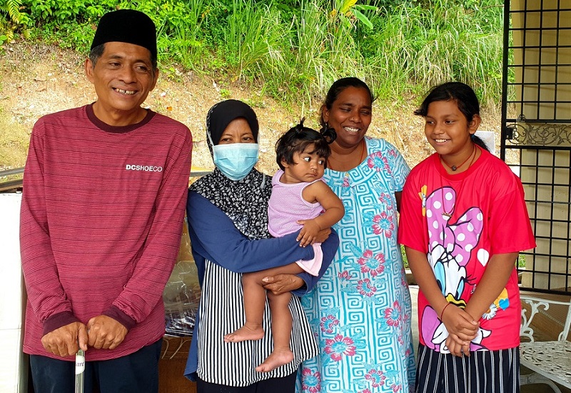 Fakhrulzaman and his wife Rohayati with Linda and her two children at their home in Seremban. u00e2u20acu2022 Bernama pic