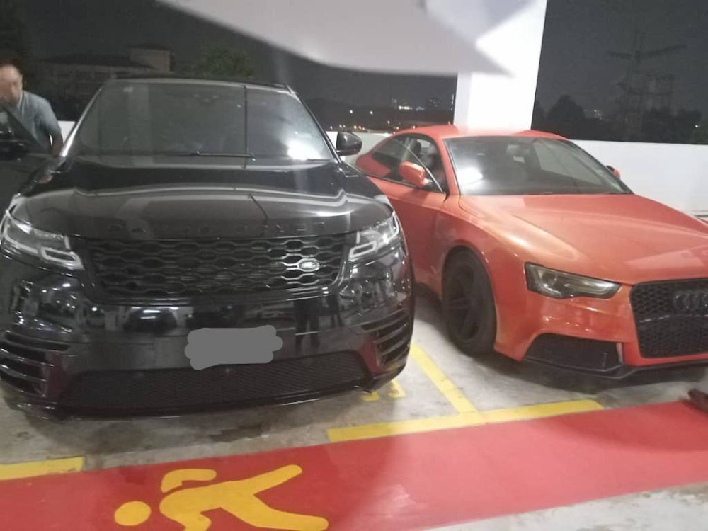 MACC investigators confiscated a Rolls-Royce limousine, a Ford Mustang, a Range Rover and an Audi during a crackdown on a people-smuggling syndicate November 20, 2020. — Picture from social media