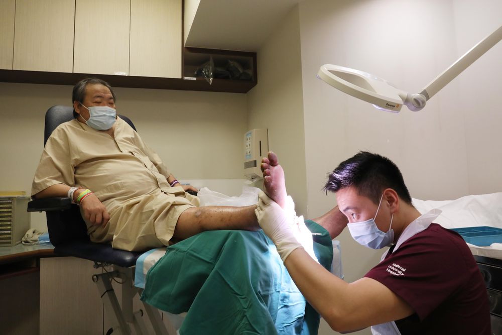 William Teo (left) underwent five cycles of maggot debridement therapy at the National University Hospital. — TODAY pic