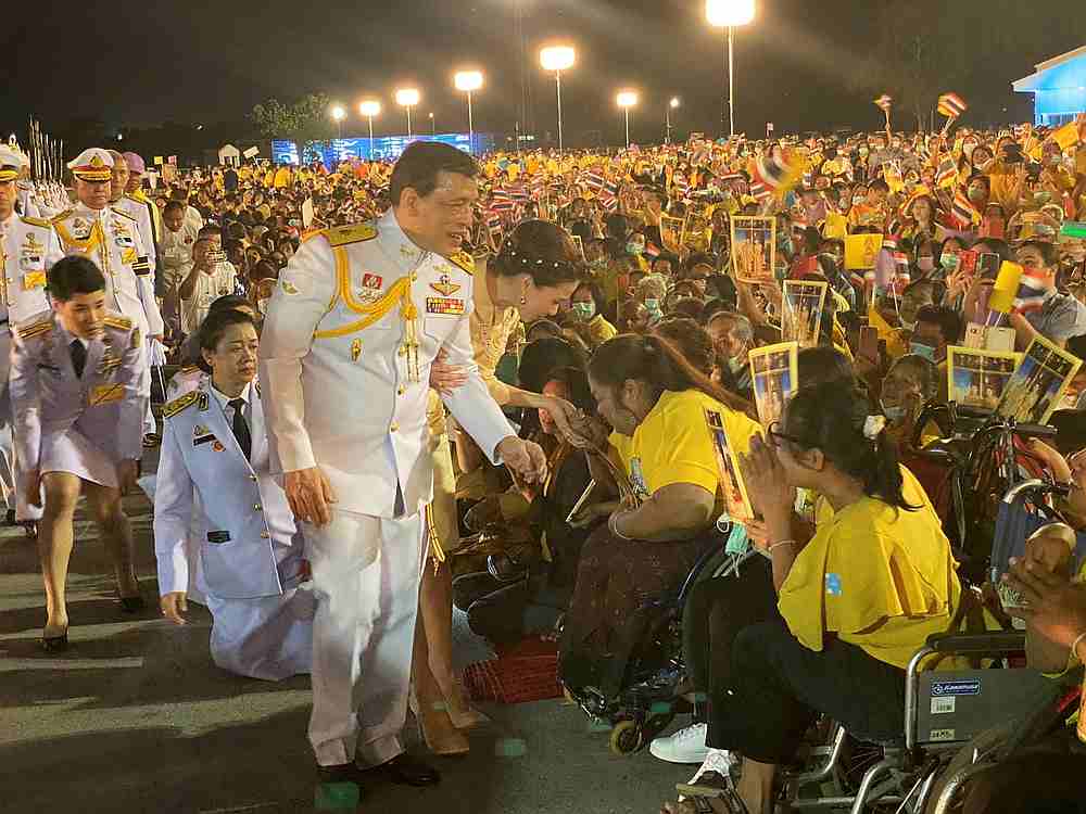 Thailand's King Maha Vajiralongkorn and Queen Suthida greet royalists at an airport in Udon Thani province, Thailand November 10, 2020. u00e2u20acu201d Royal Household Bureau handout via Reuters