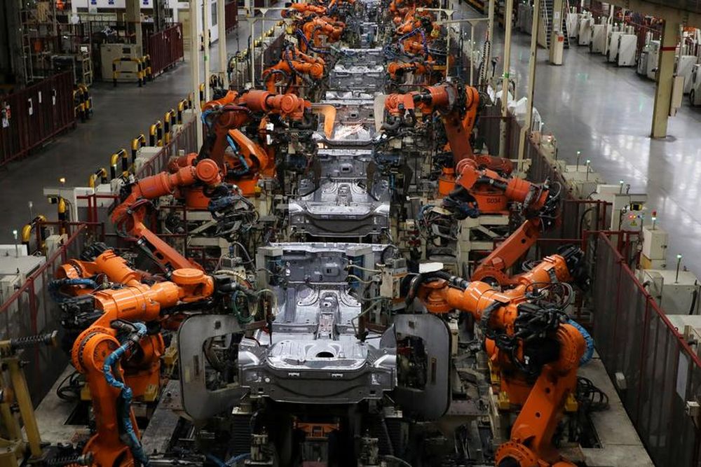 Robots welding body-shells of car are pictured on the assembly line in the Proton manufacturing plant in Tanjung Malim, December 16, 2019. u00e2u20acu201d Reuters pic