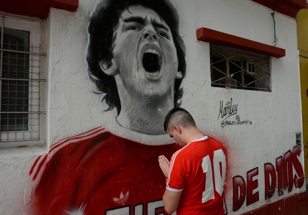 A fan reacts while mourning the death of football legend Diego Maradona, outside the Diego Amrando Maradona stadium, in Buenos Aires November 25, 2020. u00e2u20acu201d Reuters pic