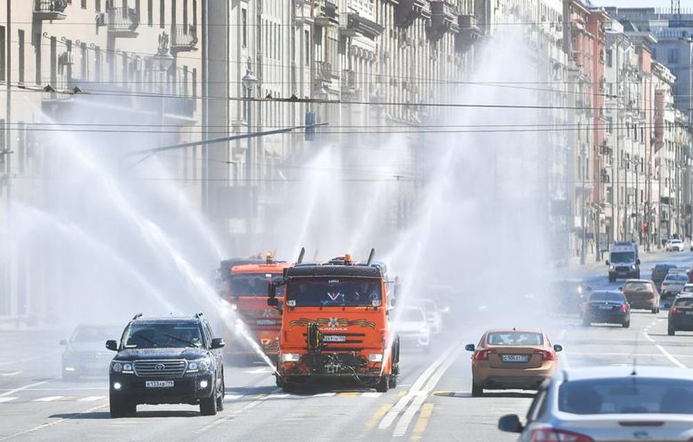 Vehicles spray disinfectant while sanitizing a road amid the outbreak of the coronavirus disease (Covid-19) in Moscow, Russia May 1, 2020. u00e2u20acu201d Moscow News Agency/Handout pic via Reuters