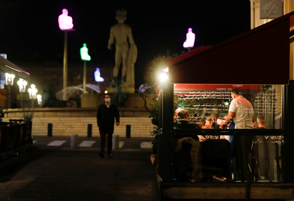 People are seen at a restaurant before the nightly curfew due to restrictions against the spread of the coronavirus disease in Nice, France, October 23, 2020. u00e2u20acu201d Reuters pic
