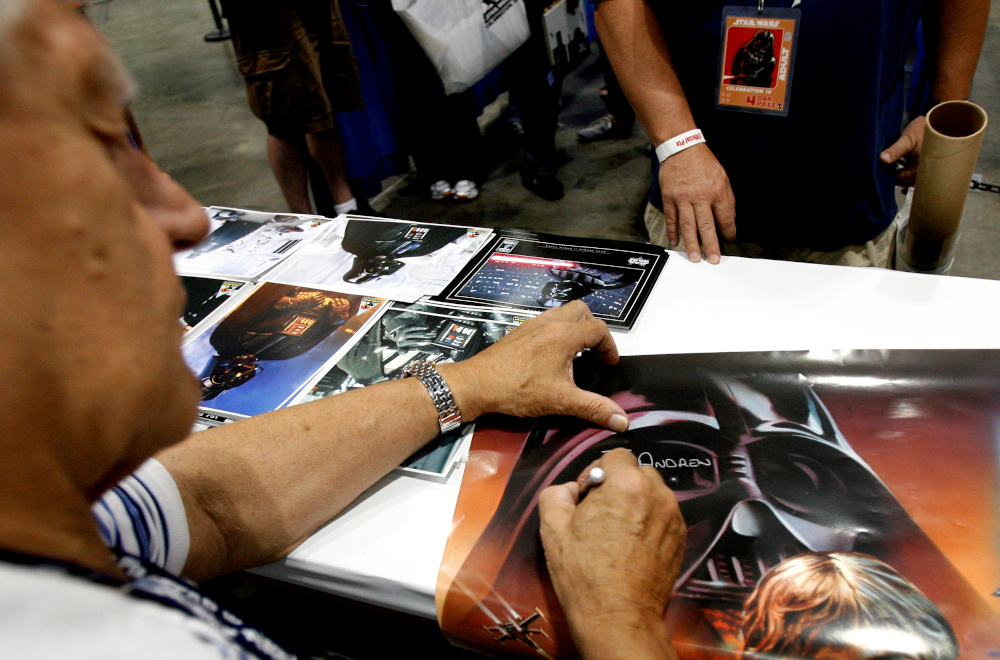 Actor David Prowse, who portrayed Darth Vader, signs autographs during the opening day of ‘Star Wars Celebration IV’ in Los Angeles in this file photo taken on May 24, 2007. — Reuters pic