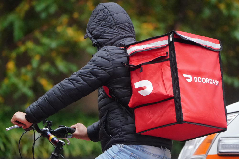 A delivery person for Doordash rides his bike in the rain during the coronavirus disease (Covid-19) pandemic in the Manhattan borough of New York November 13, 2020. u00e2u20acu201d Reuters pic
