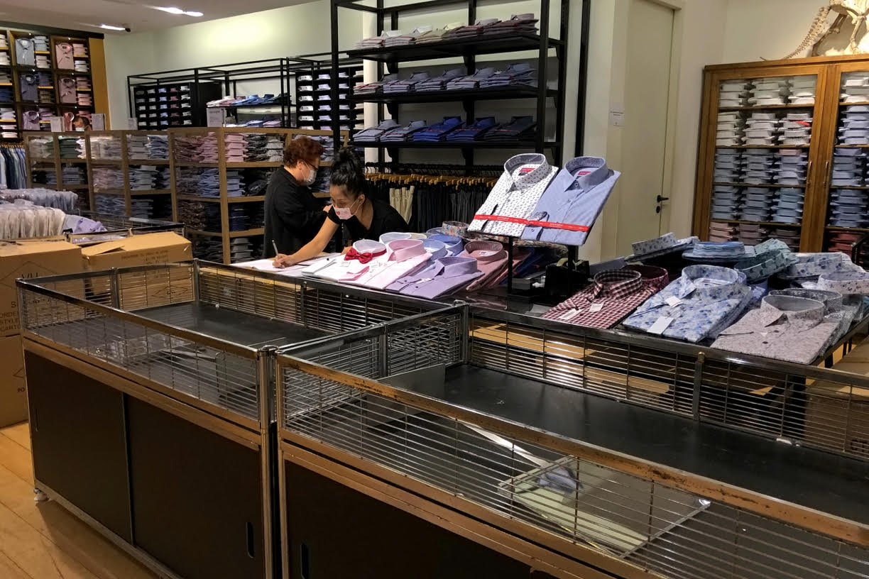 Many of the shelves in-store were half-empty at Robinsons department store as employees take stock and pack up goods. — TODAY pic