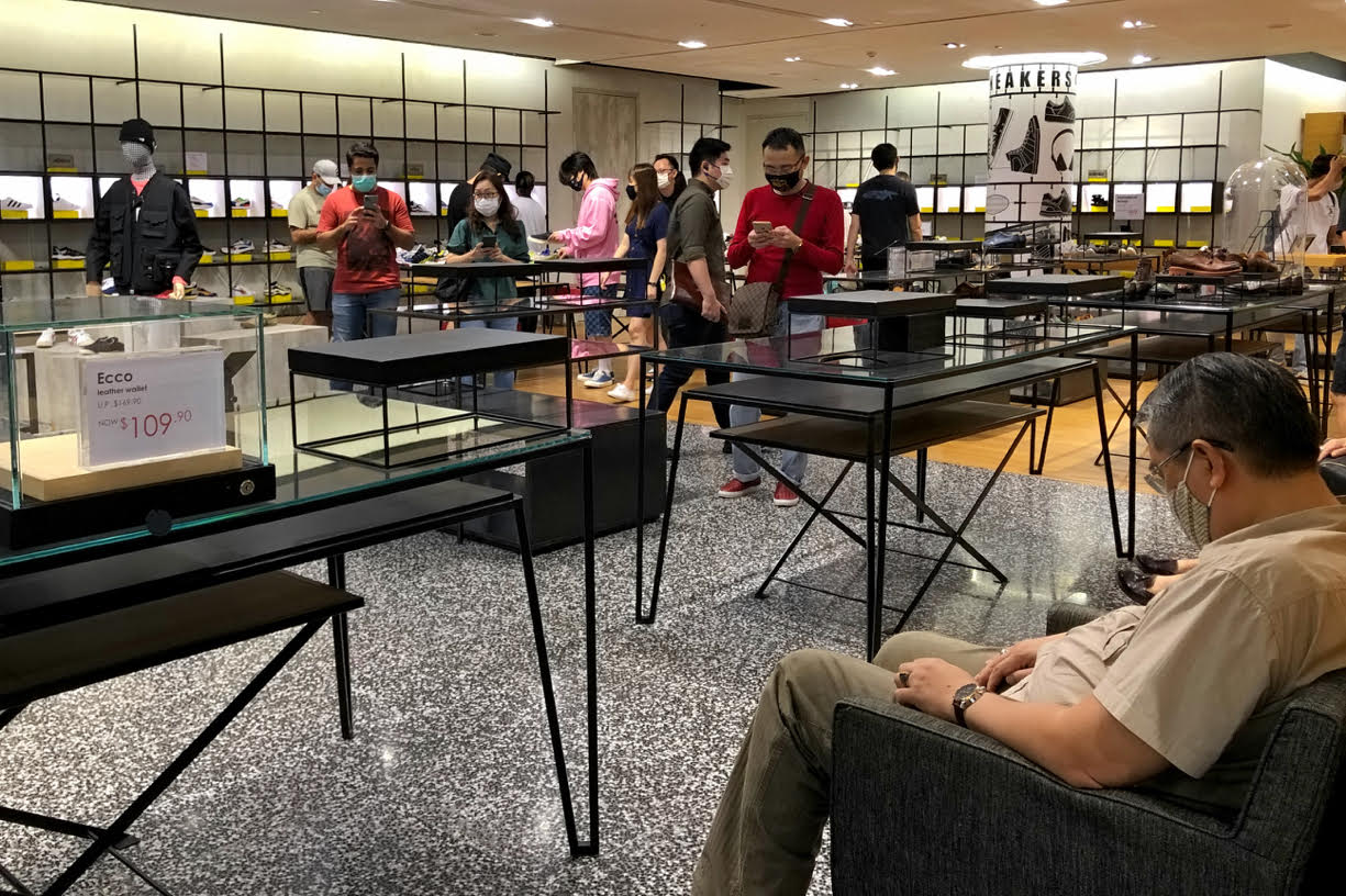 Customers browsing at what remains at the shoes department of Robinsons, The Heeren. — TODAY pic