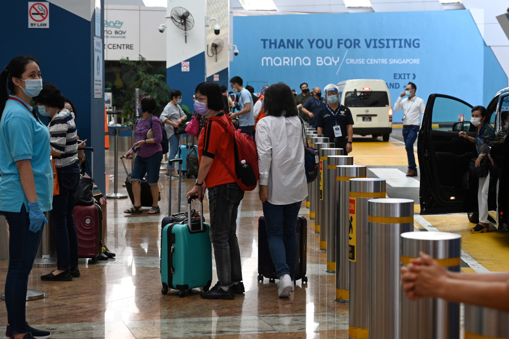 Passengers arrive at the departure area at Marina Bay Cruise Centre in Singapore on November 6, 2020 for a u00e2u20acu02dccruise to nowhereu00e2u20acu2122 in a bid to revive its pandemic-hit tourism industry. u00e2u20acu201d AFP pic