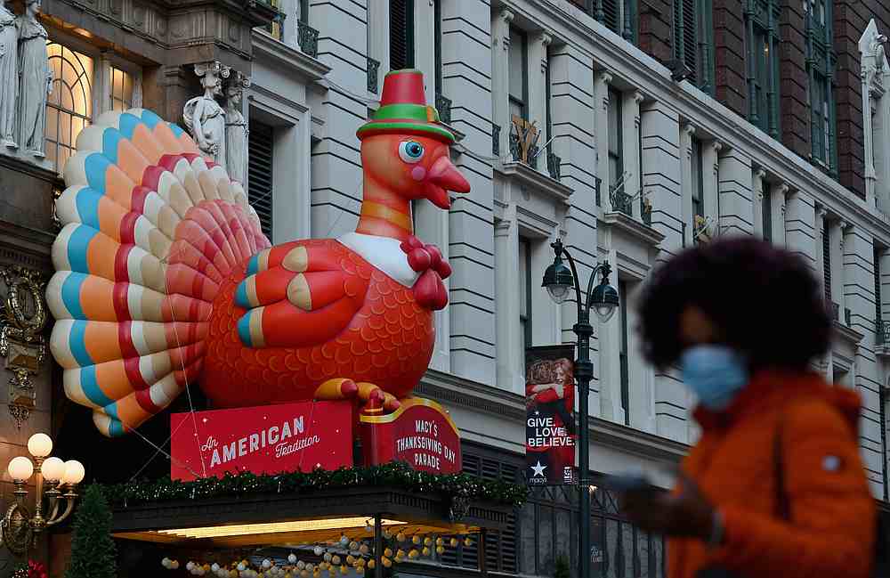 People take photos of Thanksgiving turkey decorations at Macy's Herald Square store. u00e2u20acu201d AFP pic