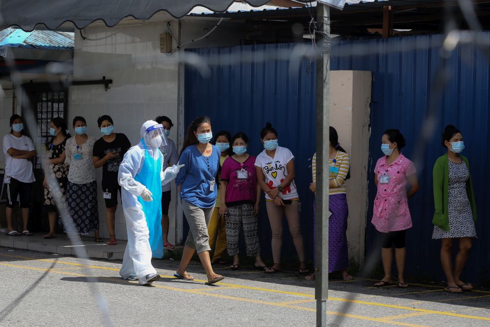 Foreign workers wait to get tested for Covid-19 at Top Gloveu00e2u20acu2122s female staff dormitory in Klang November 18, 2020. u00e2u20acu201d Picture by Yusof Mat Isa