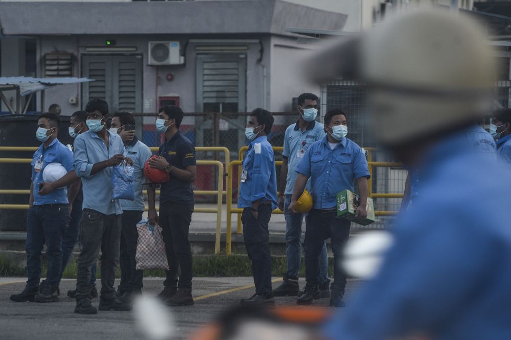 Workers are pictured outside a Top Glove factory in Klang November 26, 2020. u00e2u20acu201d Picture by Miera Zulyana 