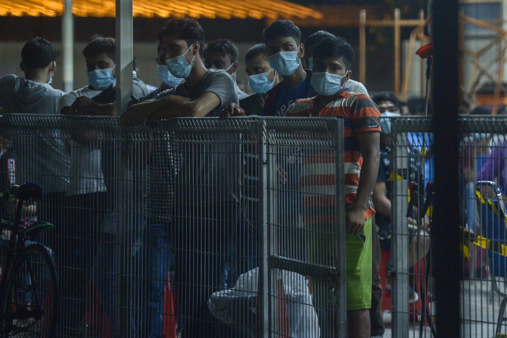 Top Glove workers gather to be screened for Covid-19 at a staff dormitory in Klang November 17, 2020. u00e2u20acu201d Picture by Miera Zulyana
