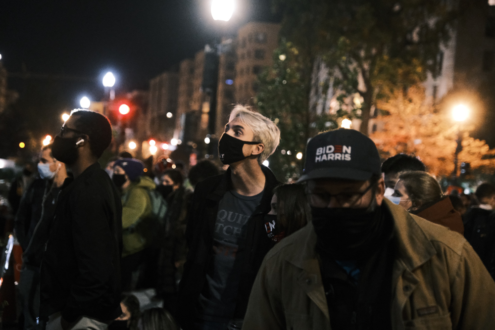 People watch Democratic presidential nominee Joe Biden give a speech shortly after midnight on Election Day November 4, 2020 in Washington, DC. u00e2u20acu201d Eze Amos/Getty Images via AFP