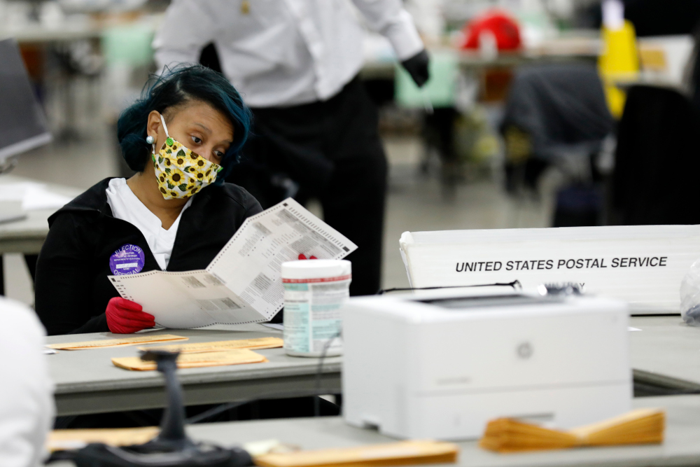Detroit election workers work on counting absentee ballots for the 2020 general election at TCF Center November 4, 2020 in Detroit, Michigan. u00e2u20acu201d AFP pic