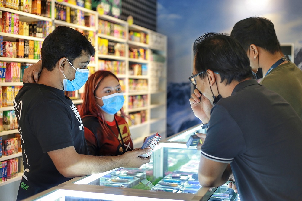 Customers buying vaping products inside a vape shop in Kuala Lumpur.