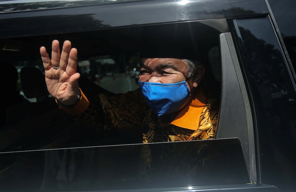 Umno President Datuk Seri Ahmad Zahid Hamidi waves as he leaves Istana Kinta in Ipoh December 6, 2020. u00e2u20acu201d Picture by Farhan Najib