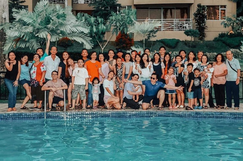 Deiseree Daniel (centre, with baby) usually goes home to Kota Kinabalu for a big year-end family gathering like this one last year. It will be a sombre affair for the family this year. — Picture courtesy of Deiseree Daniel