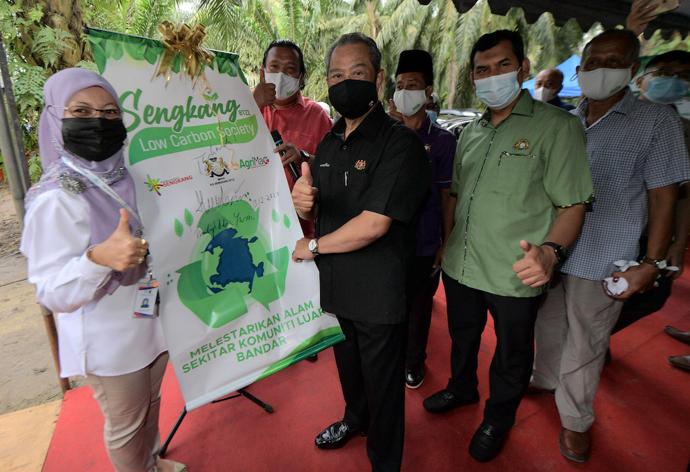 Prime Minister Tan Sri Muhyiddin Yassin launches the Low Carbon Community Programme in Kampung Sengkang Batu 22, near Bukit Gambir December 13, 2020. u00e2u20acu201d Bernama pic