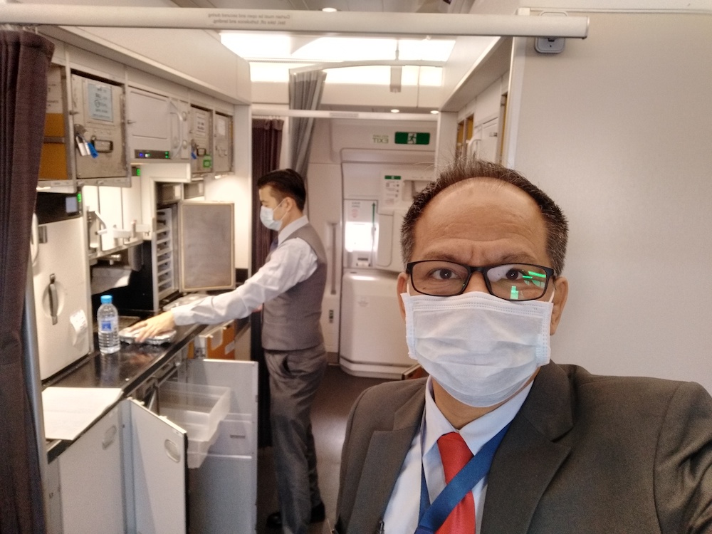 In-flight supervisor Mark Yugendran Thambyrajah (right) learned how to do short videos to motivate company staff. — Picture courtesy of Malaysia Airlines Berhad