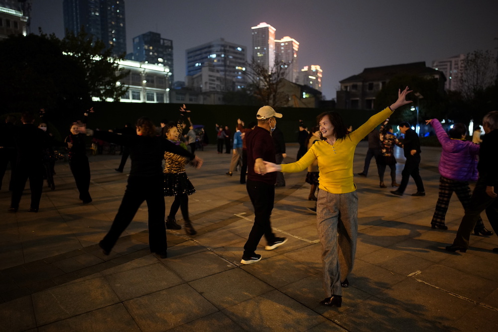 People dance at a park at night, almost a year after the global outbreak of the coronavirus disease (Covid-19) in Wuhan December 11, 2020. — Reuters pic