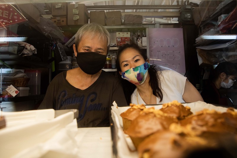Amber Pong, 30, the owner of The Headless Baker stall at the Ghim Moh food centre, with her father Pong Weng Matt. — TODAY pic
