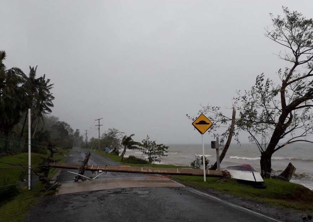 A fallen electric pole due to Cyclone Yasa lies on Lesiaceva Road in Savusavu, Fiji, December 18, 2020, in this image obtained via social media. u00e2u20acu201d Fiji Roads Authority handout via Reuters