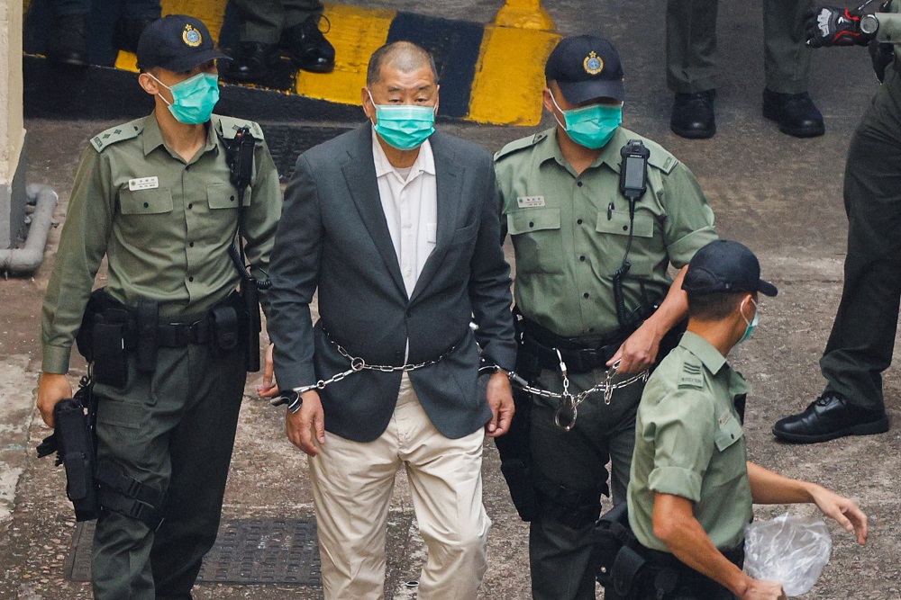Media mogul Jimmy Lai Chee-ying, founder of Apple Daily, walks to a prison van to head to court, after being charged under the national security law, in Hong Kong December 12, 2020. u00e2u20acu201d Reuters pic